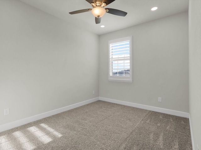 carpeted empty room with ceiling fan