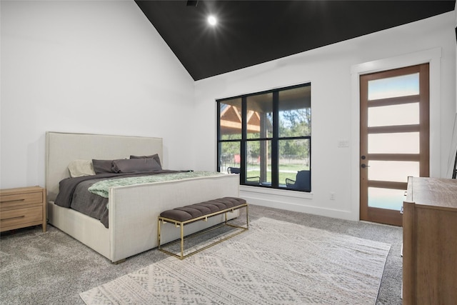 bedroom featuring carpet floors, high vaulted ceiling, and multiple windows