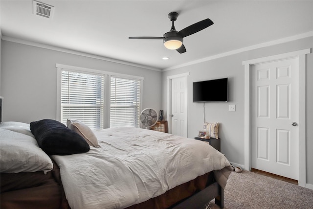 bedroom with ceiling fan and ornamental molding