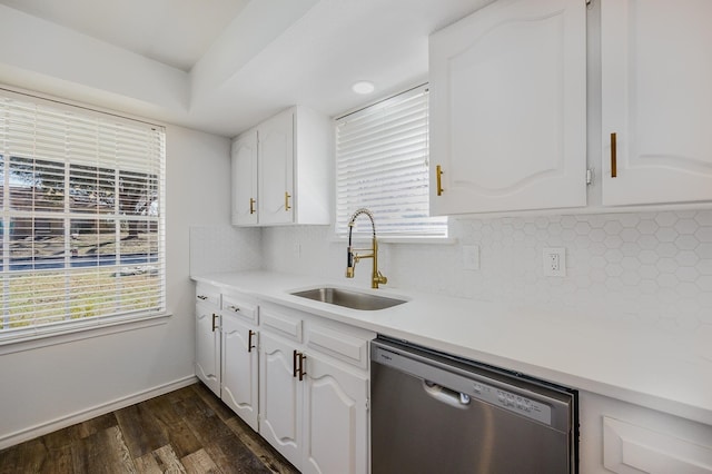 kitchen with dishwasher, backsplash, sink, dark hardwood / wood-style flooring, and white cabinetry