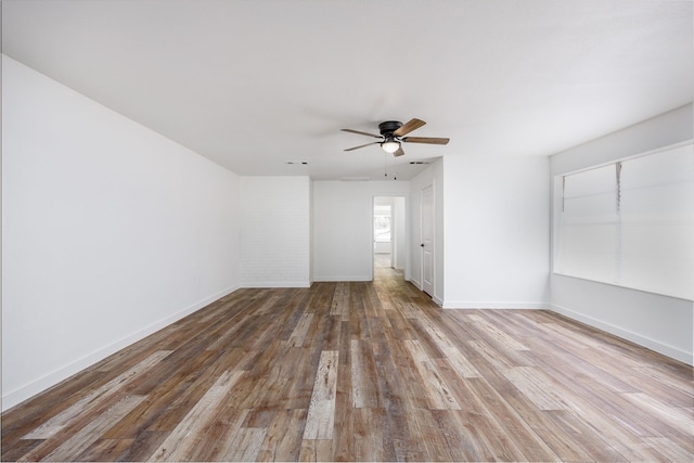 unfurnished room featuring hardwood / wood-style floors and ceiling fan