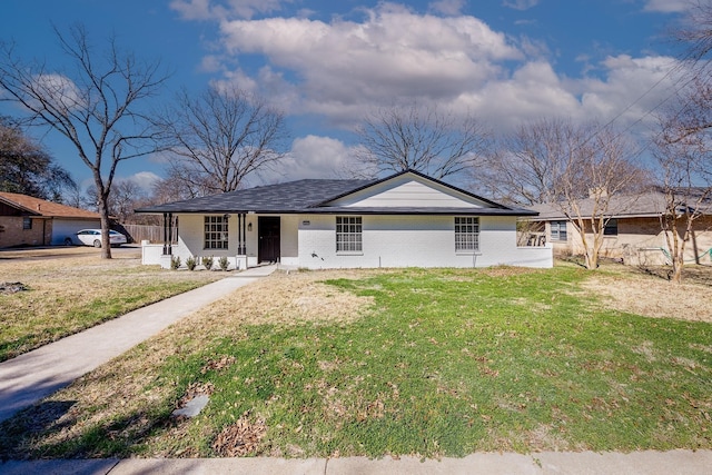 single story home with a front yard and covered porch