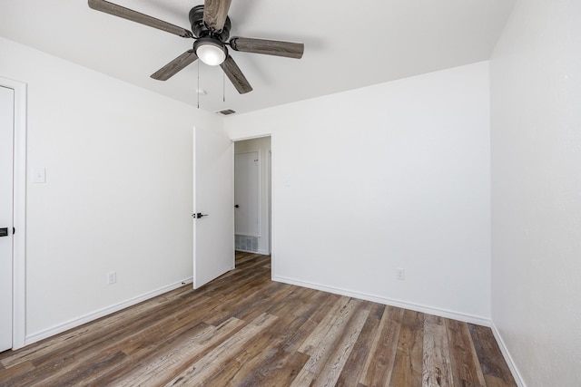 unfurnished room featuring ceiling fan and dark hardwood / wood-style floors