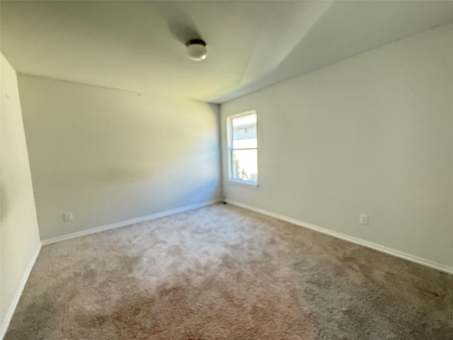 unfurnished room featuring carpet floors