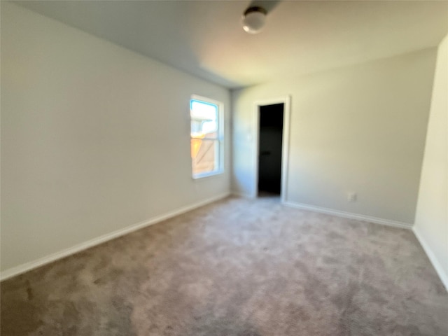 unfurnished bedroom with light carpet