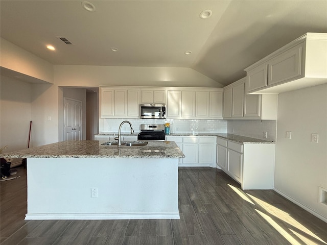 kitchen with a kitchen island with sink, sink, white cabinets, and appliances with stainless steel finishes