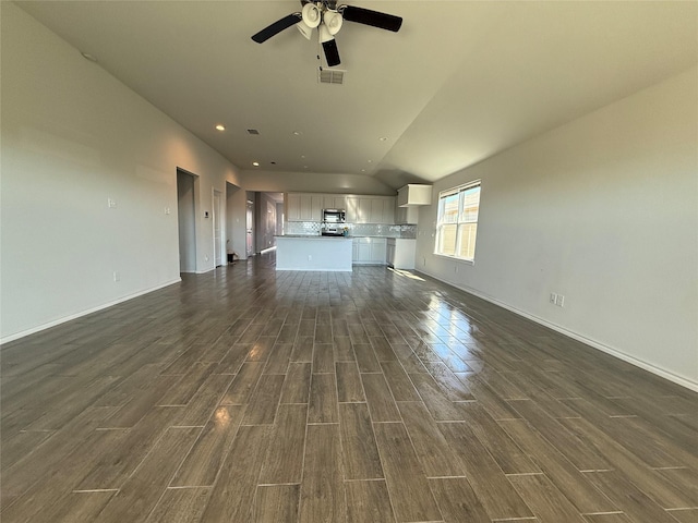 unfurnished living room featuring ceiling fan and lofted ceiling