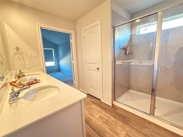 bathroom with vanity and an enclosed shower