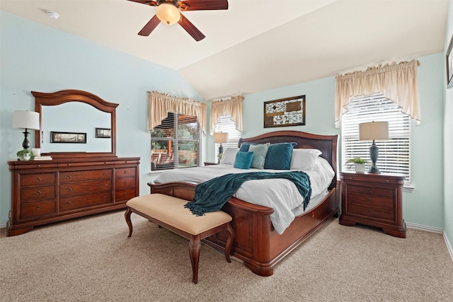 carpeted bedroom featuring vaulted ceiling and ceiling fan