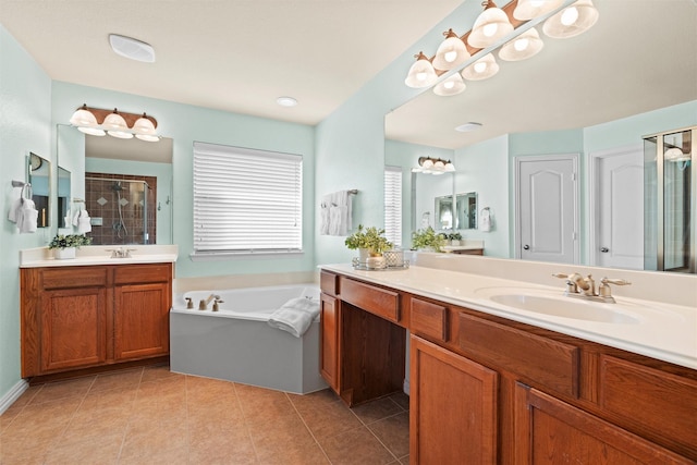 bathroom with tile patterned floors, vanity, and independent shower and bath