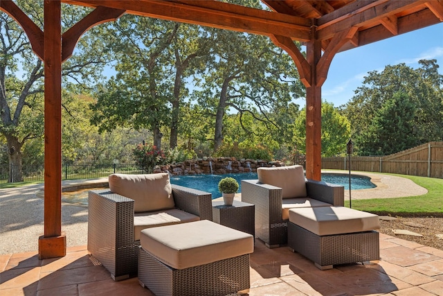 view of patio / terrace with a fenced in pool and pool water feature