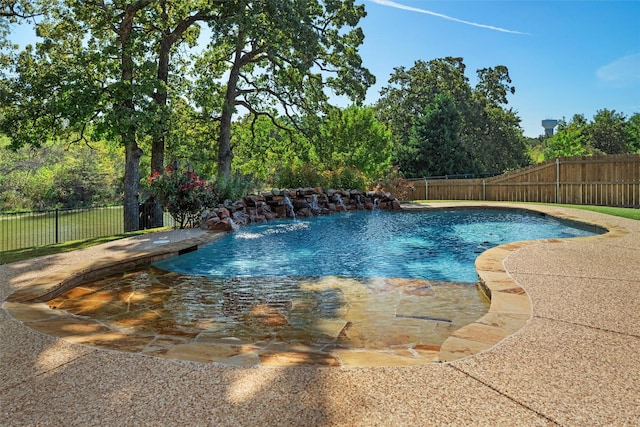 view of swimming pool featuring pool water feature