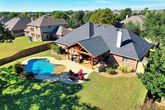 view of swimming pool featuring a lawn, a patio area, and an outdoor hangout area