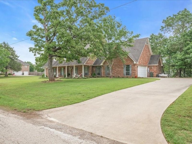 ranch-style home featuring a front yard and a garage