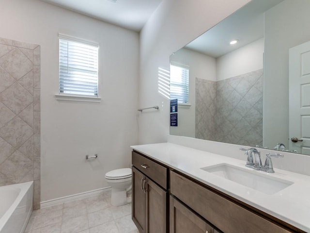 bathroom featuring tile patterned flooring, vanity, and toilet