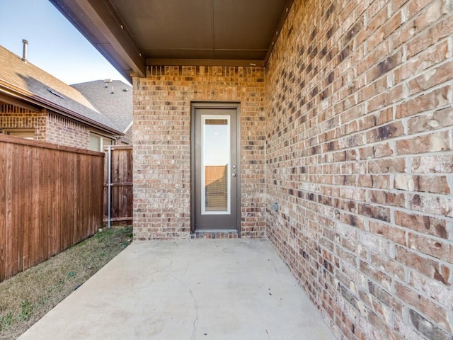 doorway to property featuring a patio area