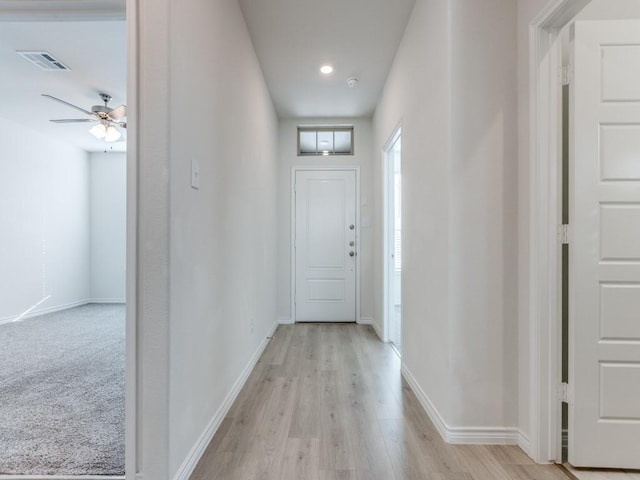 hallway featuring light hardwood / wood-style flooring