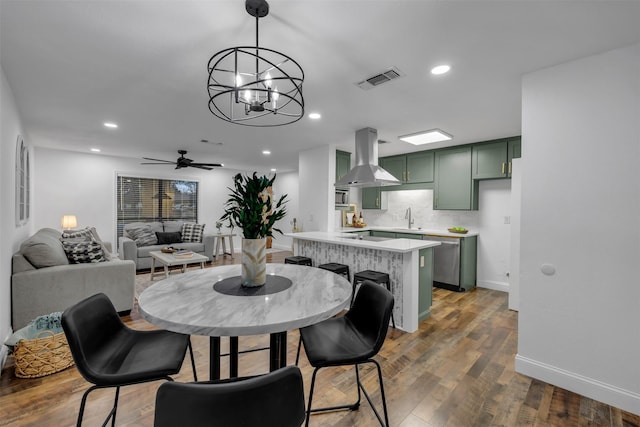 dining area with recessed lighting, visible vents, ceiling fan, wood finished floors, and baseboards