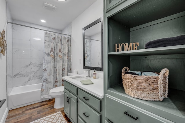 full bath with visible vents, shower / bathtub combination with curtain, toilet, vanity, and wood finished floors