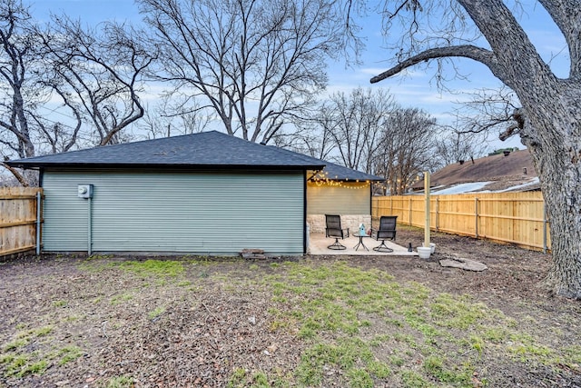 view of outdoor structure featuring a fenced backyard