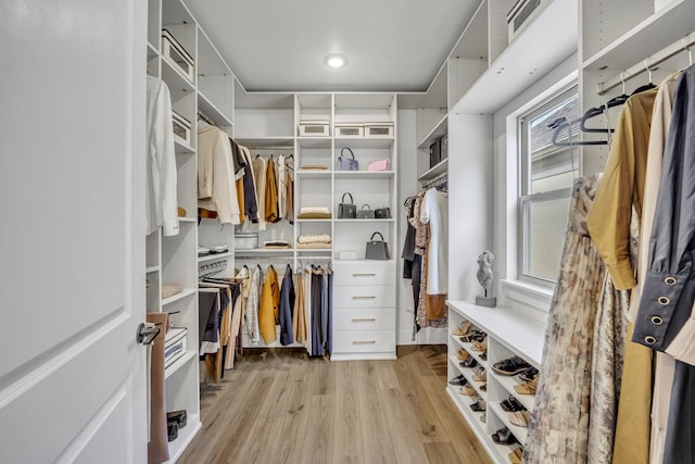 walk in closet featuring light hardwood / wood-style floors