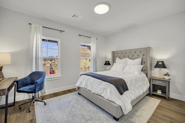 bedroom with hardwood / wood-style floors