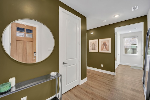 foyer entrance with light wood-type flooring