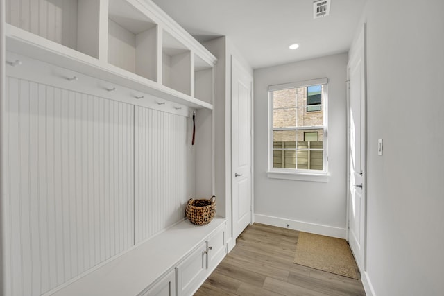 mudroom with light hardwood / wood-style floors