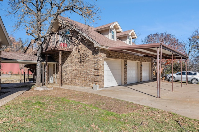 view of front of home featuring a balcony and a garage