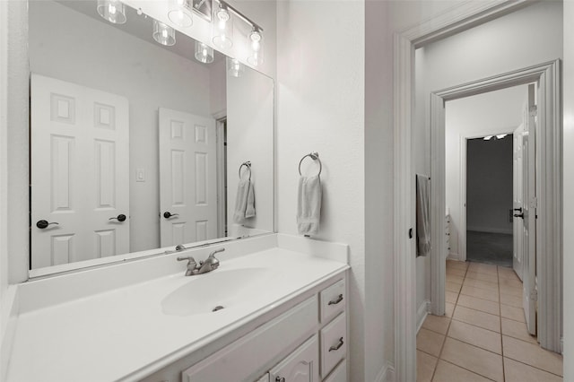 bathroom with tile patterned flooring and vanity