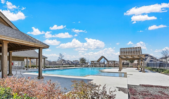 view of swimming pool featuring a pergola, a patio, and a gazebo