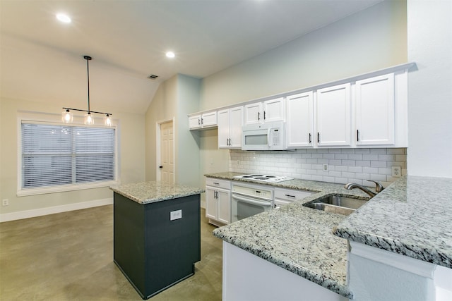 kitchen with white cabinetry, sink, kitchen peninsula, pendant lighting, and white appliances