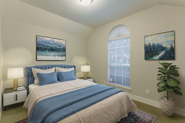 bedroom featuring lofted ceiling