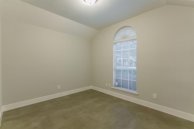 empty room with lofted ceiling