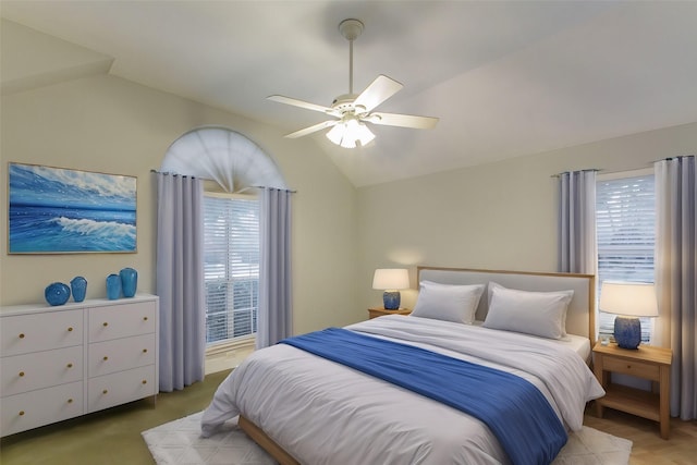 bedroom featuring ceiling fan and vaulted ceiling