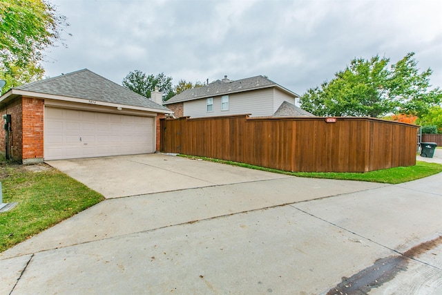 view of property exterior featuring a garage