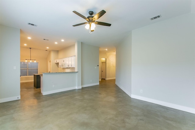 unfurnished living room with ceiling fan