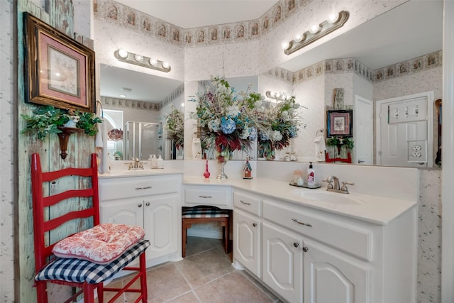 bathroom with tile patterned flooring, vanity, and an enclosed shower