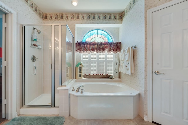 bathroom with plus walk in shower and tile patterned flooring