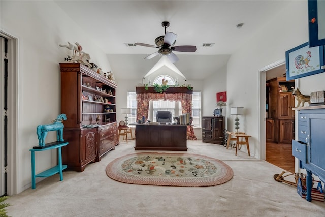 carpeted office space featuring ceiling fan and lofted ceiling