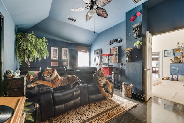 living room featuring ceiling fan and lofted ceiling