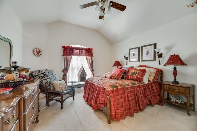 bedroom with ceiling fan, light colored carpet, and vaulted ceiling