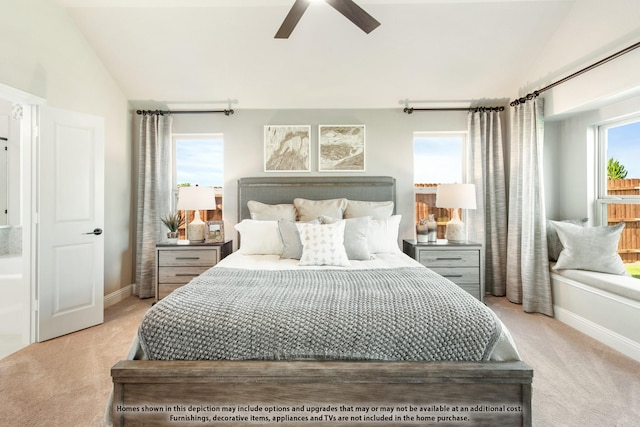 carpeted bedroom with ceiling fan and lofted ceiling