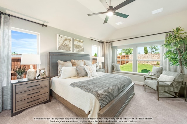 bedroom featuring multiple windows, light carpet, ceiling fan, and lofted ceiling