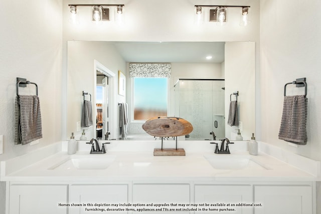 bathroom featuring vanity and an enclosed shower