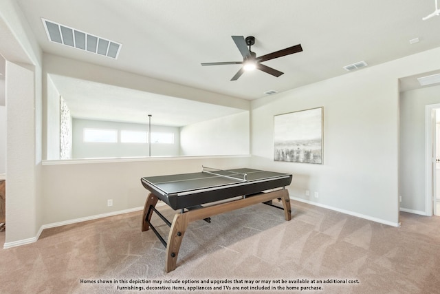 playroom with ceiling fan and light carpet