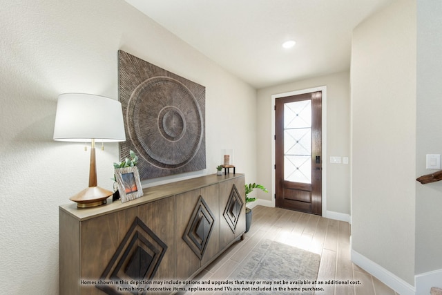 foyer entrance featuring light wood-type flooring