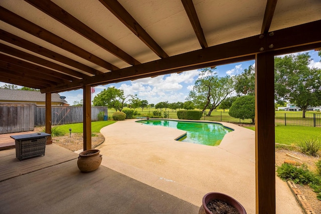 view of pool featuring a yard and a patio