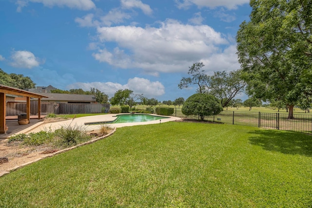 view of yard featuring a fenced in pool and a patio area