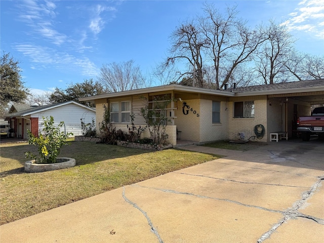 ranch-style house with a carport and a front lawn